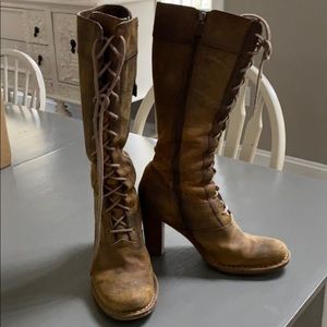 Frye distressed lace up boots.